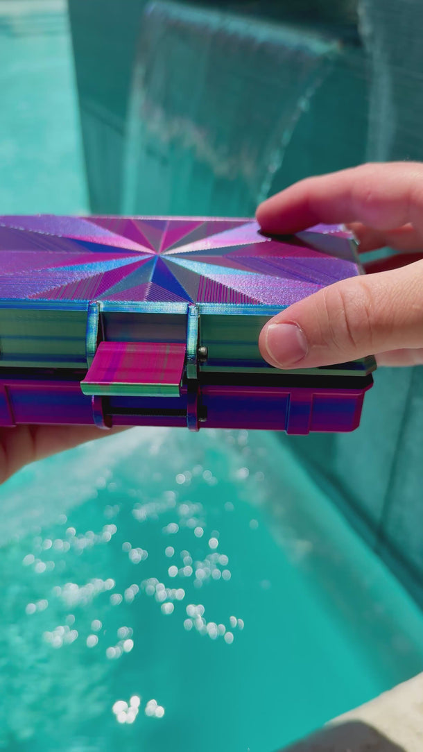 Video of Purple and Green open case containing various items including vials and a syringe on a white background